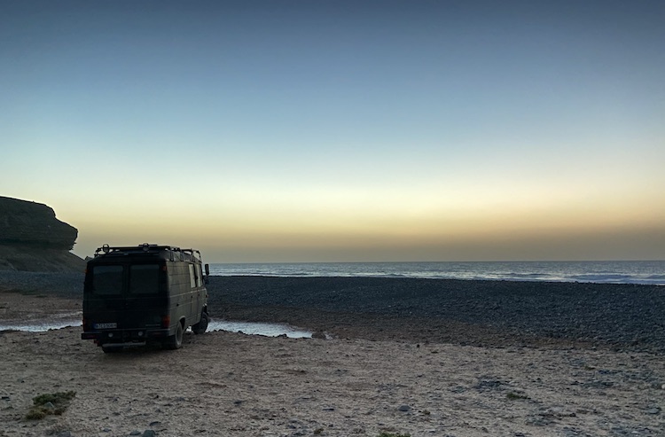 Van parked in front of Playa de Vigocho