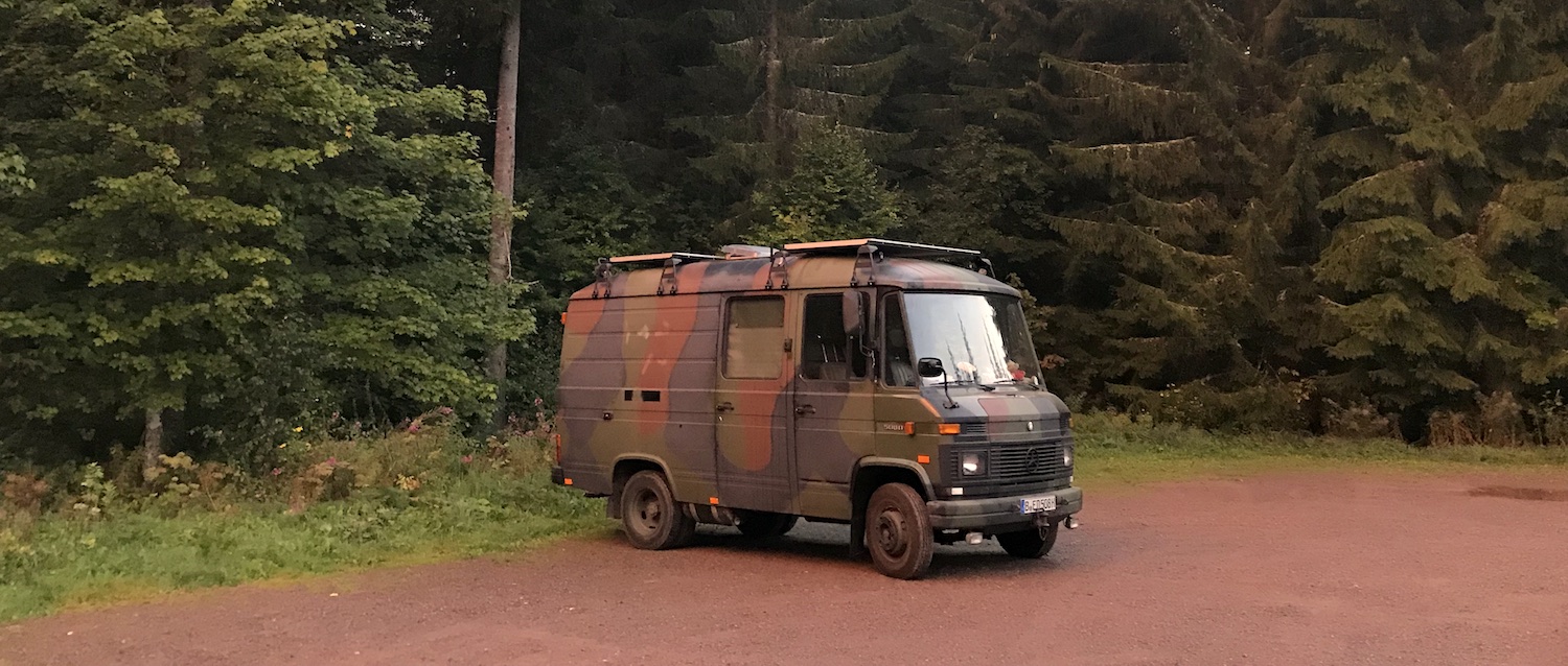 Van parked in the forest