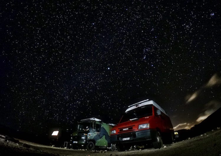 Vans parked under the stars