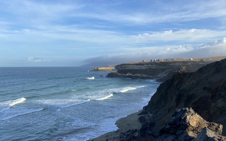 Vans parked at the cliffs La Pared