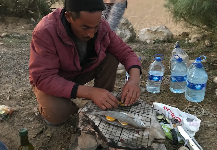 Brahim preparing the fish