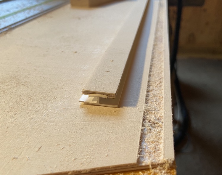 Wooden strips glued on guide rails