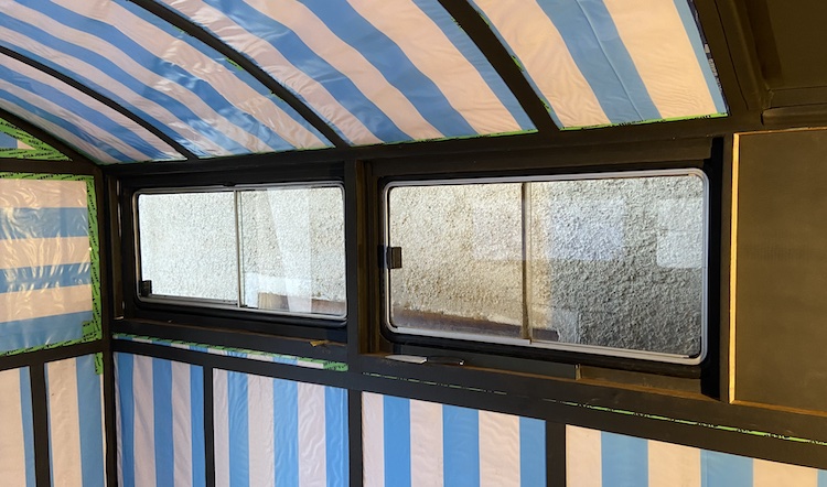 Installing wooden frames and mosquito nets in front of the windows