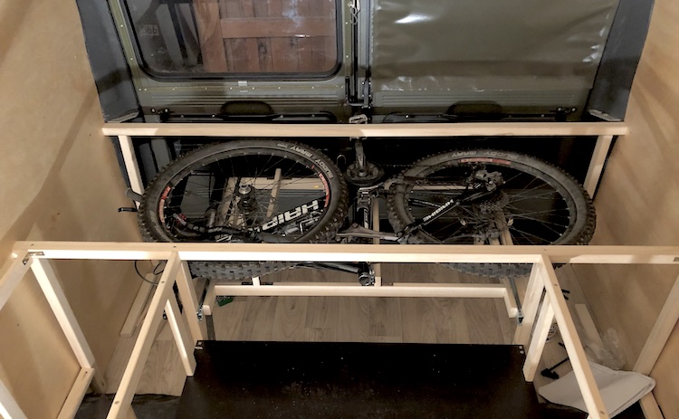 Bike store under the bed in the van