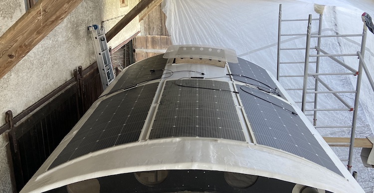 Five solar panels mounted on the front roof