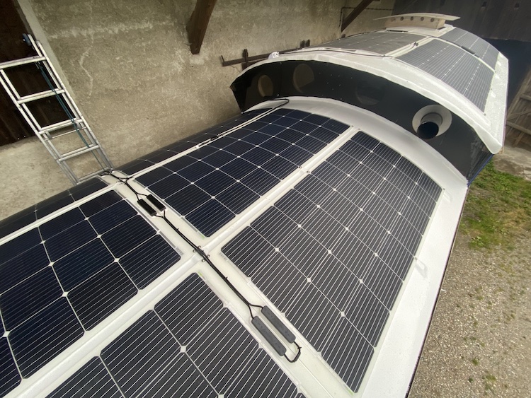 11 solar panels mounted on the front and back roof