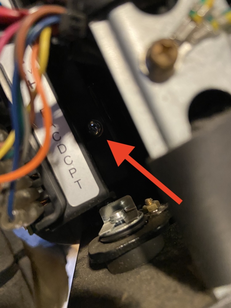 Screw holding the compressor control module