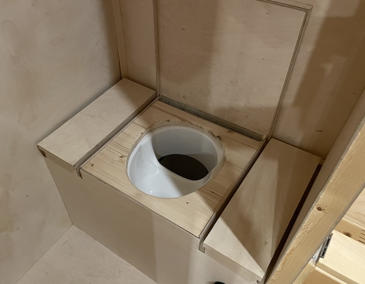 Toilet with storage compartments on both sides