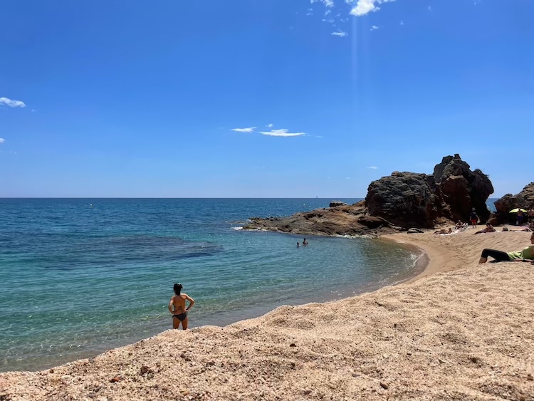 Going for a swim at Playa de Fenals