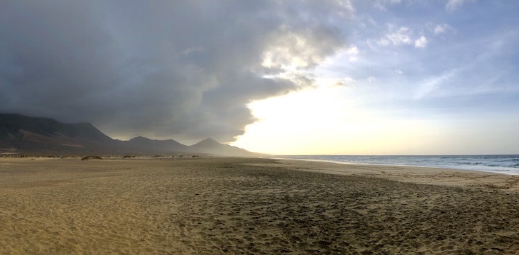 Playa de Cofete and mountains covered in clouds