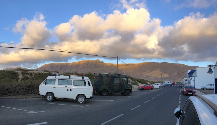 Vans parked in Famara