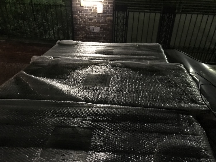 Solar panels covered in bubble wrap on the alcove