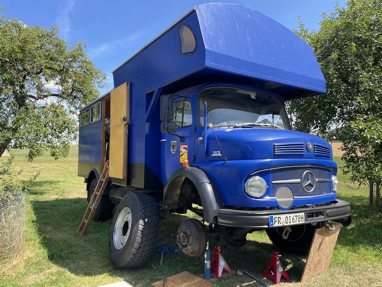 Removing the right front wheel to inspect the damage