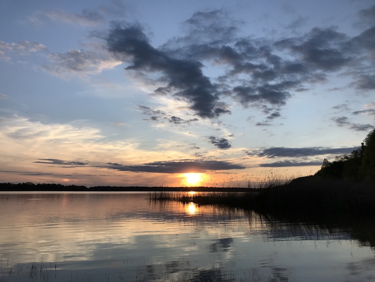 Relaxing and drinking a beer at a lake