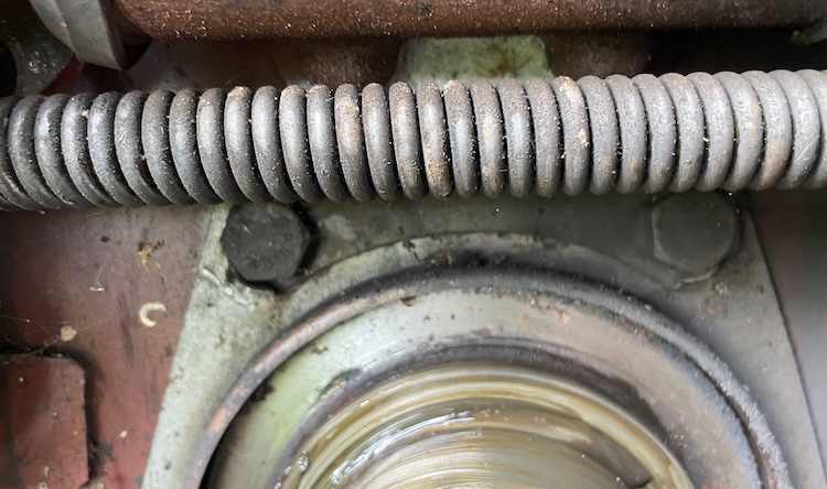 Top bolts holding the brake backing plate