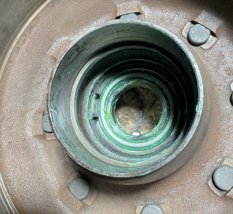 Snap ring securing the outer wheel bearing
