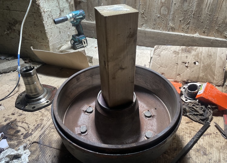 Tapping the inner wheel bearing race into the brake drum hub