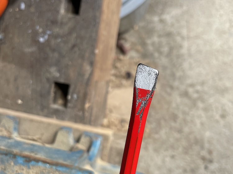 Small, lightly tapered steel rod used to push the inner wheel bearing out of the brake drum