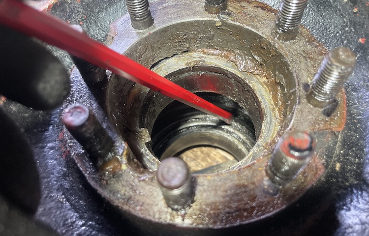 Gently tap out the inner wheel bearing from the brake drum, applying light, even blows from all sides.