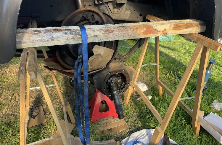 Front axle without brake and spindle sleeve