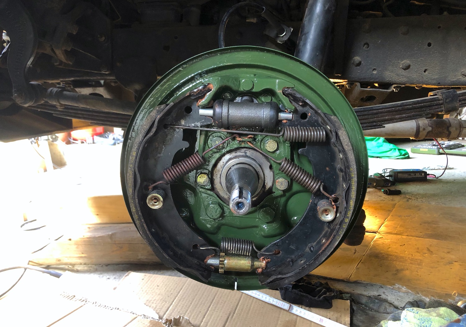 Brake pads mounted on the anchor plate of a Mercedes 508