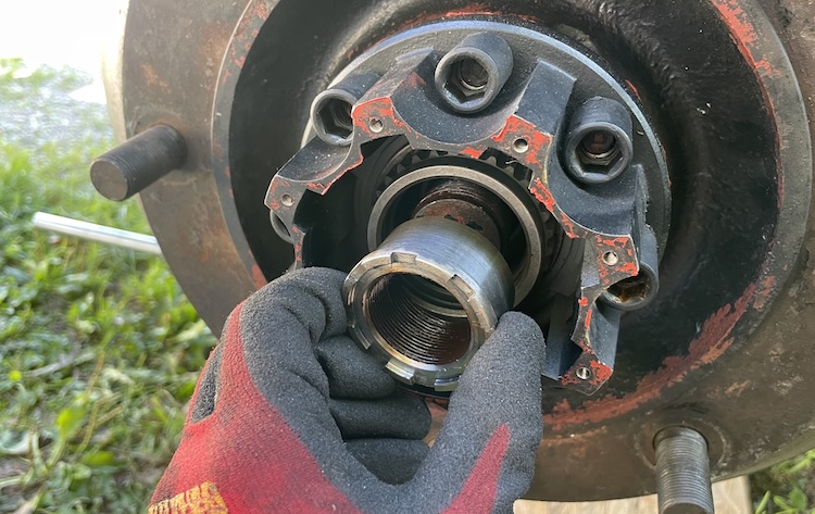 Removing the locknut from the drive shaft