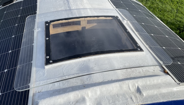 Window placed into the guide rail in the roof