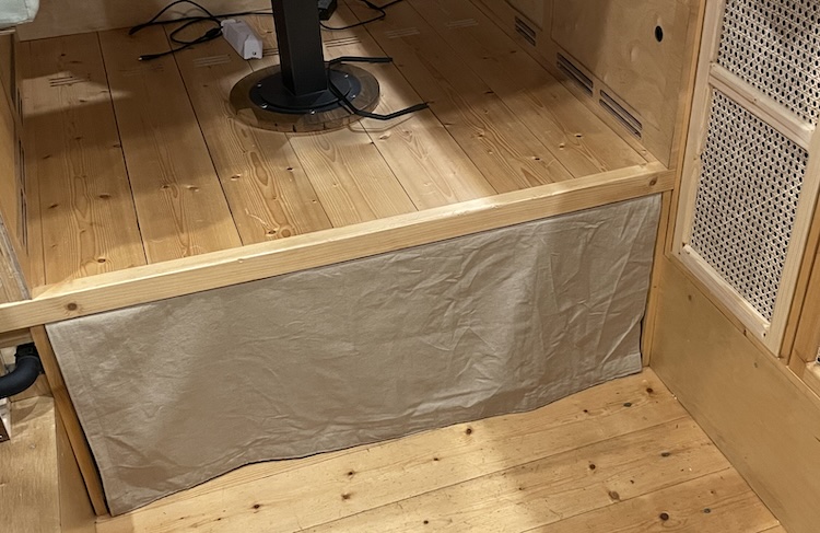 Matching curtain for the water tank beneath the table