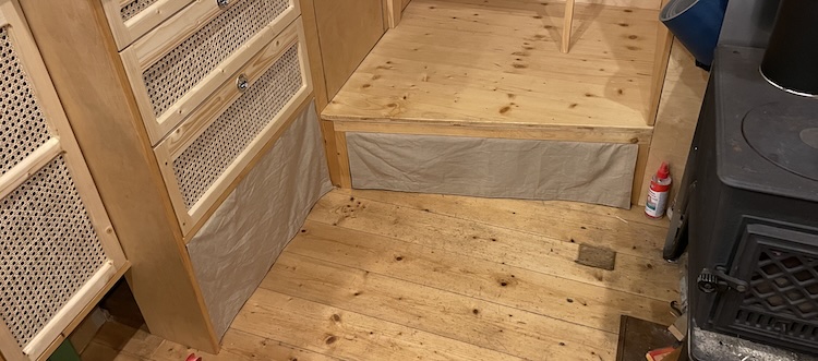 Curtains hiding the boiler and electrical setup