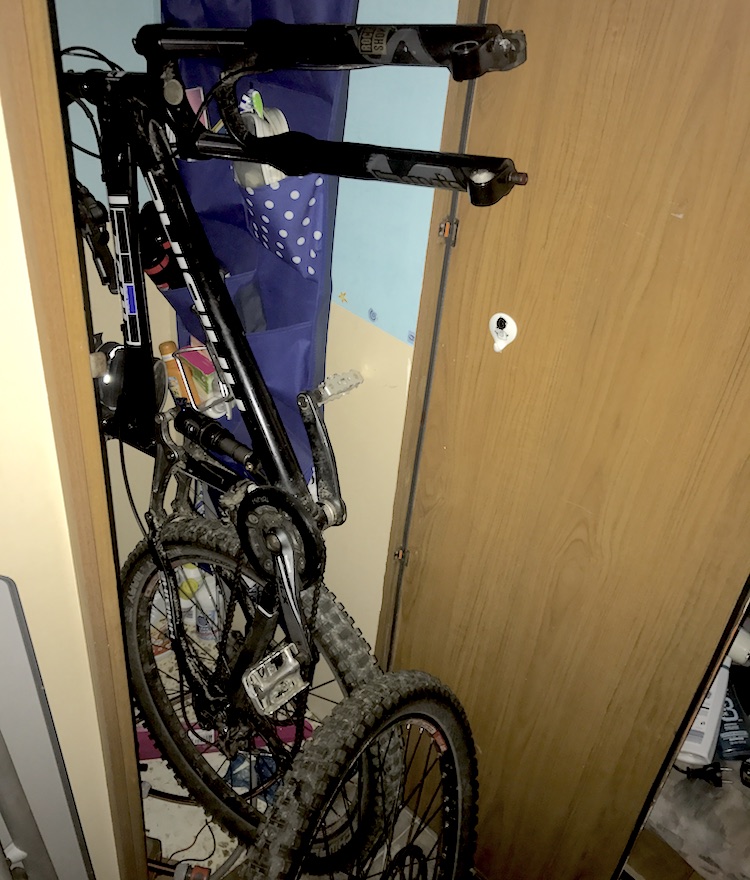 Pulling the mountain-bike out of the bathroom