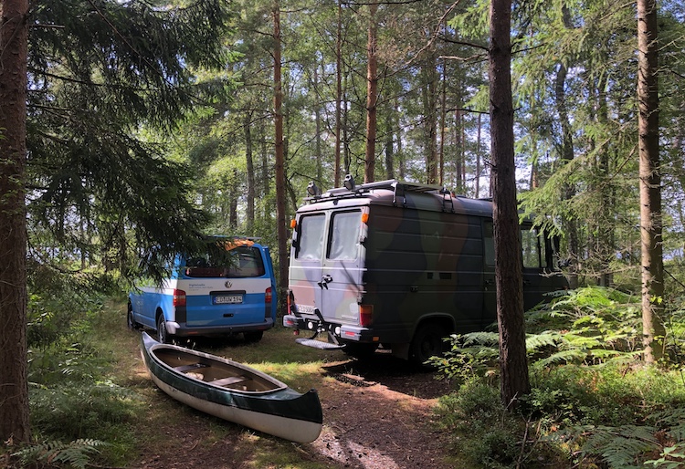 Vans parked in the woods near Örsjön