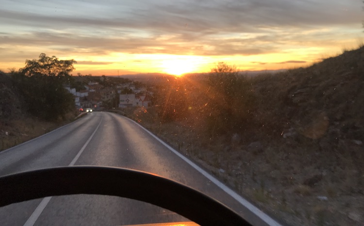 Sun set view from behind the steering wheel